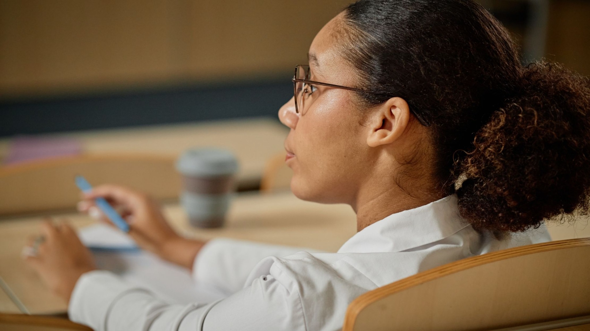Black woman studying in a classroom setting