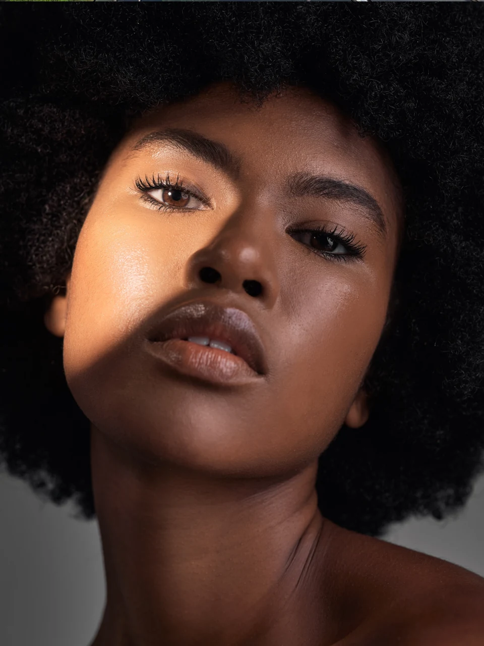 Close-up portrait of a Black woman with natural textured hair