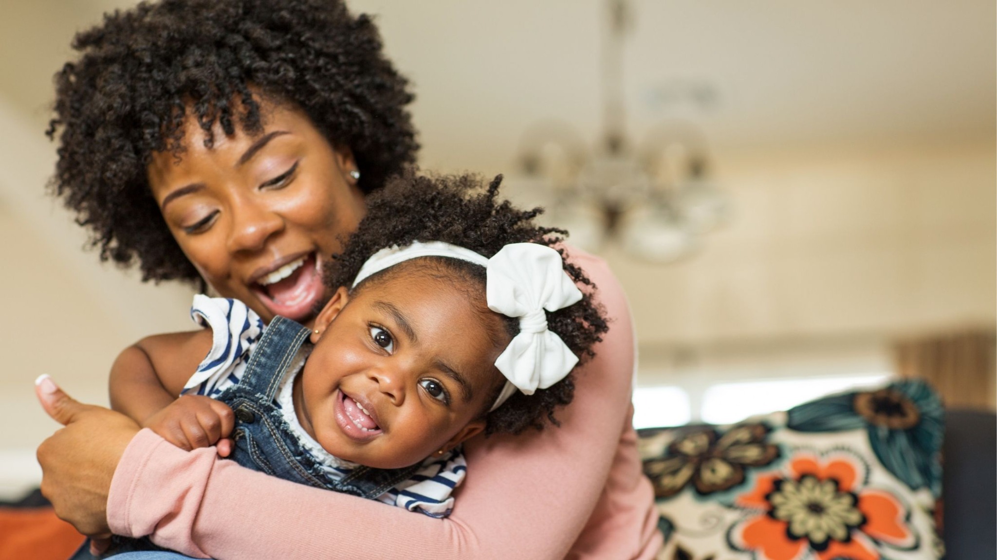 Black mother and daughter sharing a warm moment at home
