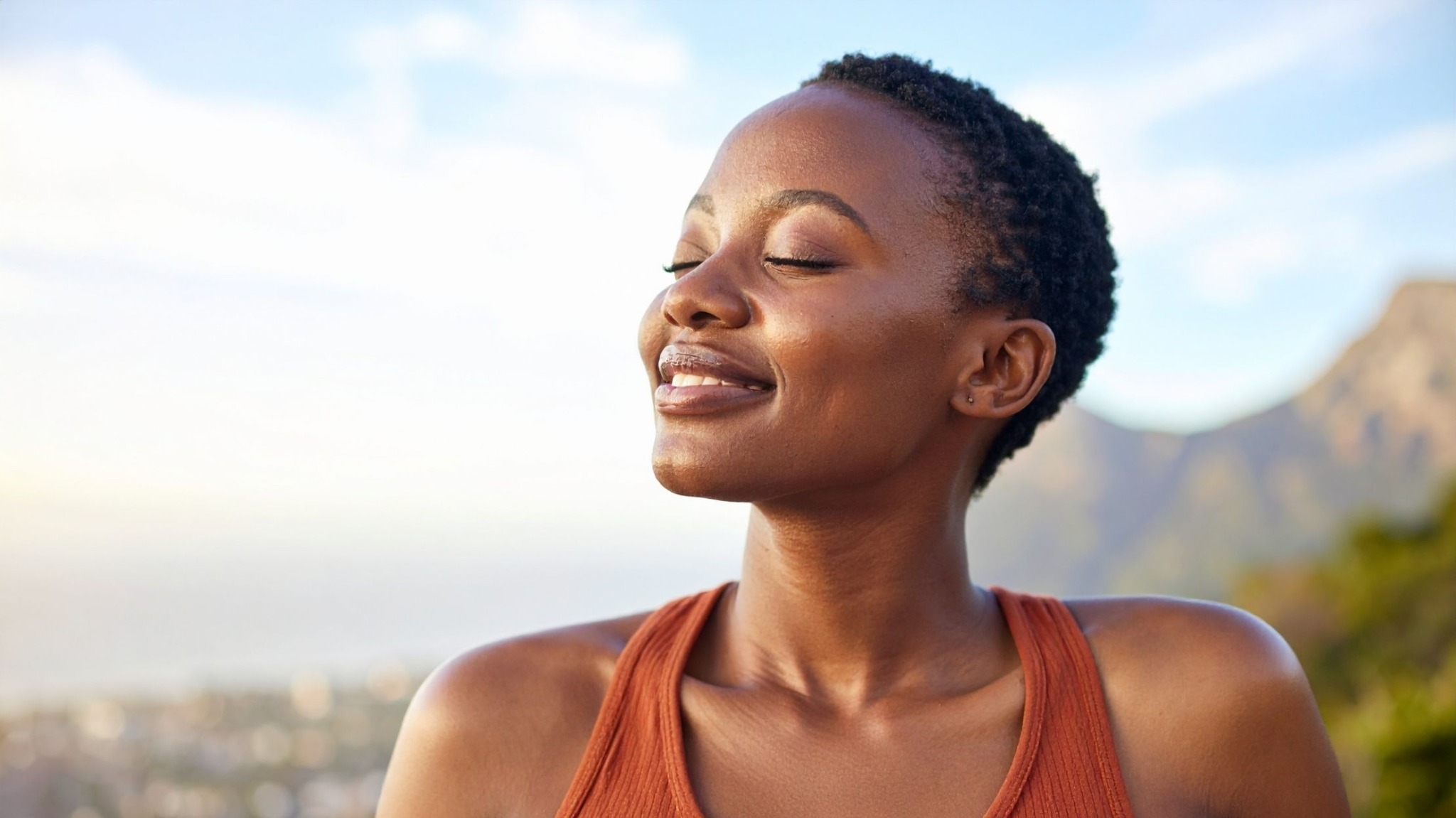 Black woman enjoying a peaceful moment outdoors
